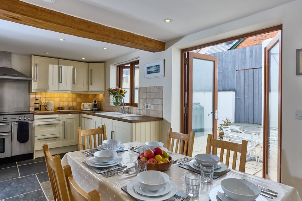 Kitchen with Dining area and doors to rear courtyard