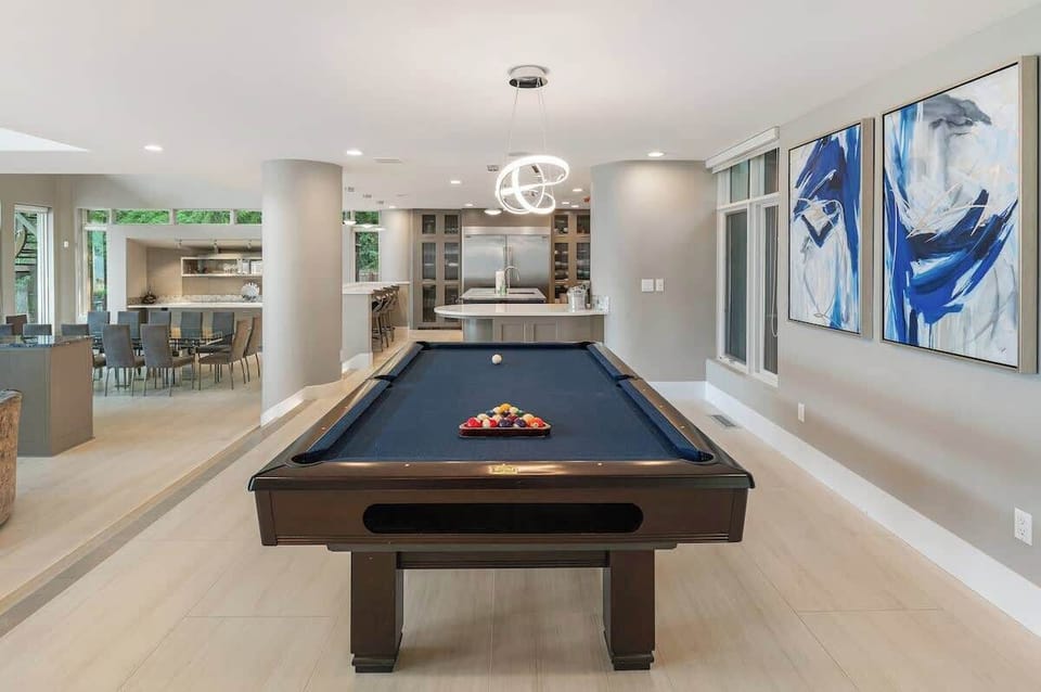 Challenge your friends to a game of billiards in this stylish and inviting space, perfect for friendly competition and relaxation