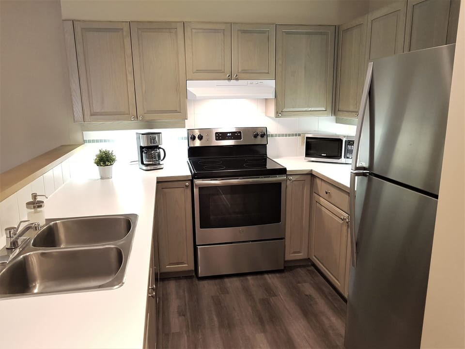 Cook your own meals in the well-appointed kitchen - it has everything you need.