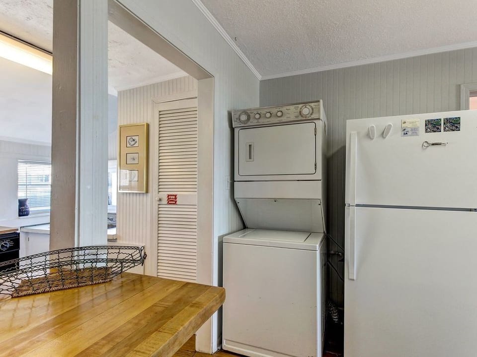 Stacked washer/dryer and refrigerator