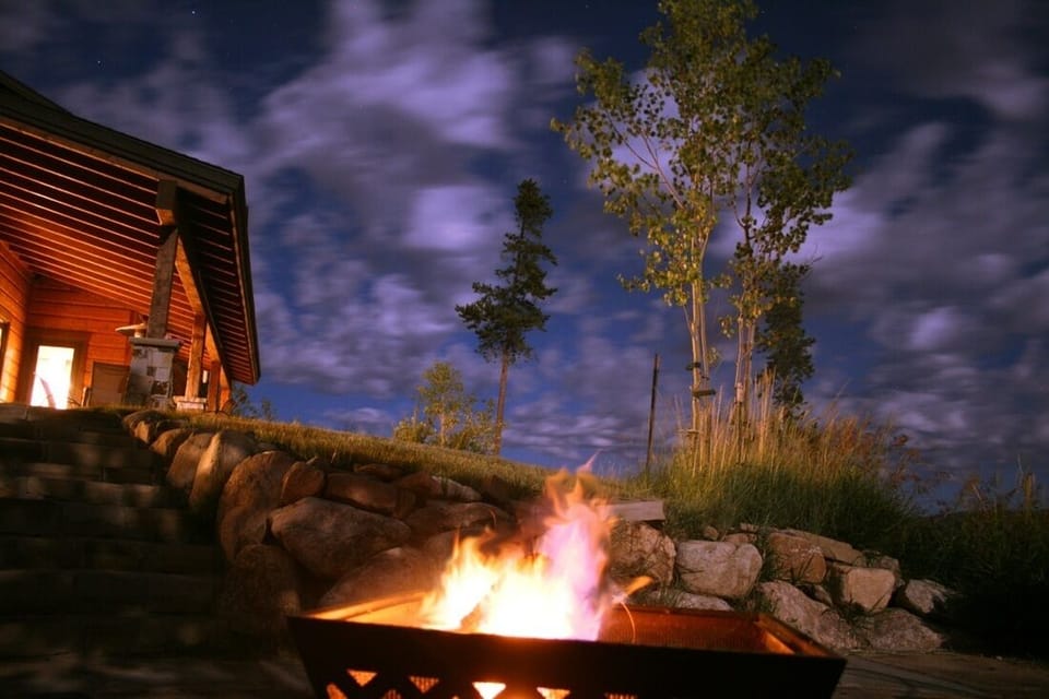 Firepit on the lower deck looking up at the back of Oso's Overlook.