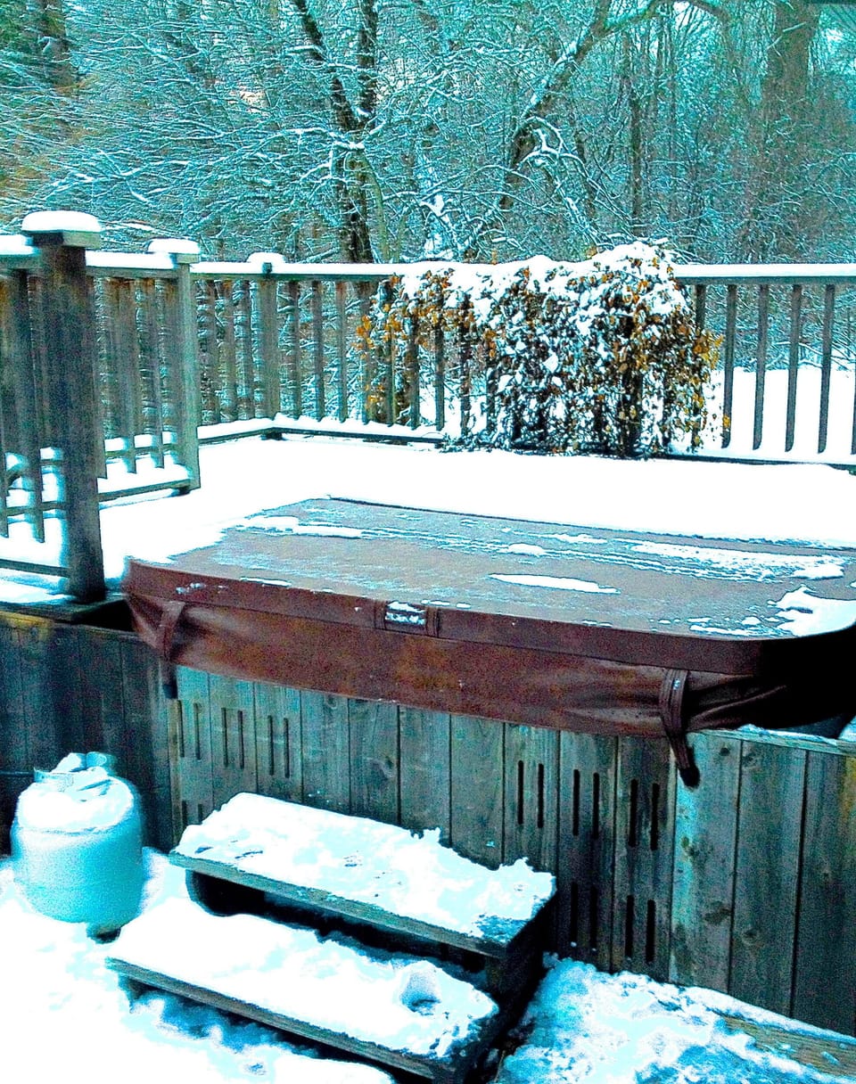 Full size Hot tub runs all winter! (Back half covered with snow.)