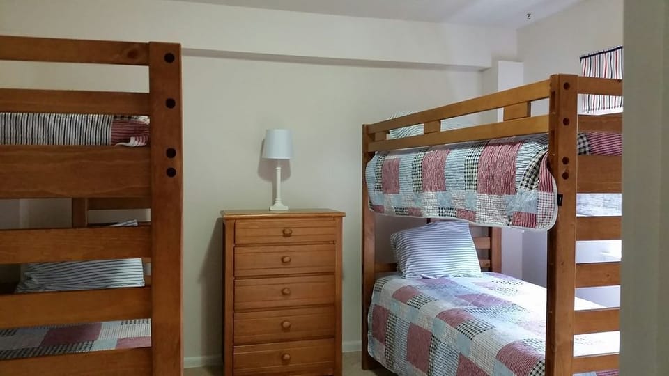 Lower level bunk room w/ 2 sets of bunks.  This level also has a full hall bath.