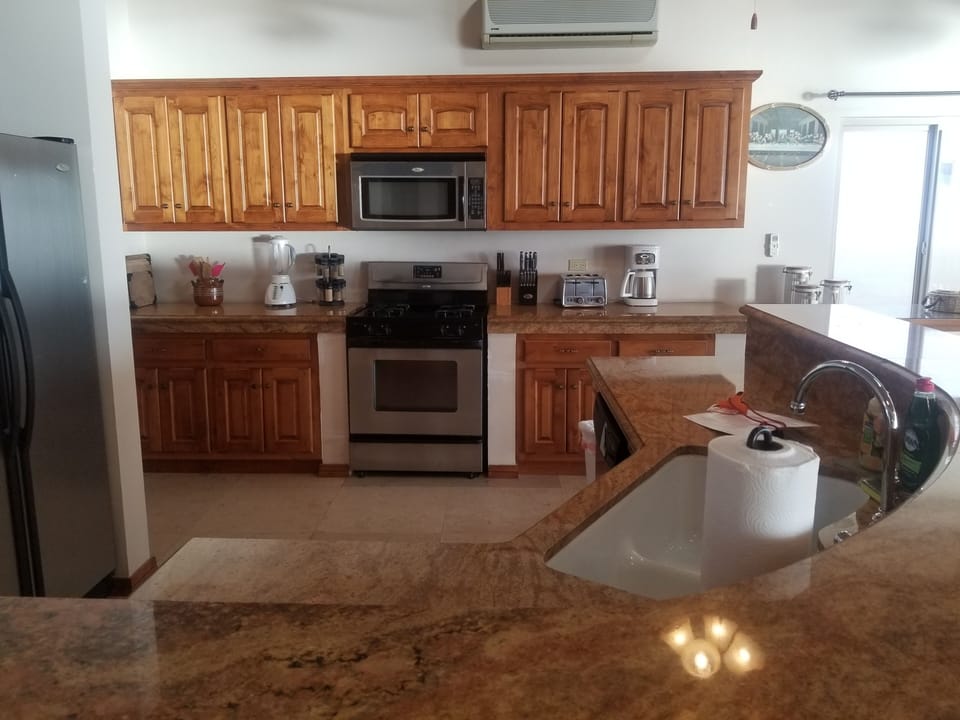 Granite bar seats 6.
Granite counters. High end appliances.