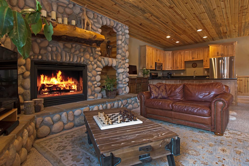 2 leather couches will seat large parties around the fire