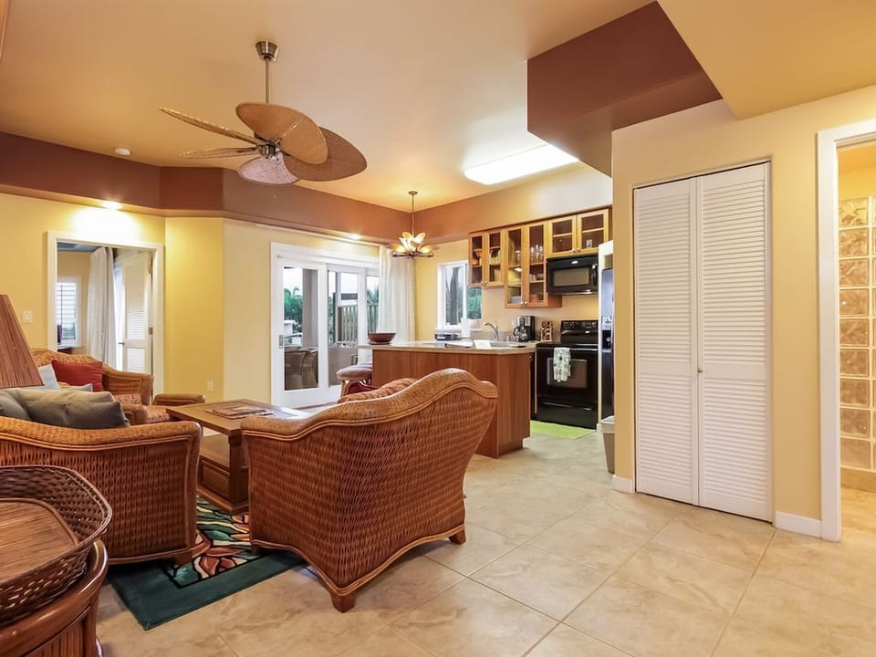 living room.  Washer and dryer behind louver doors. 
