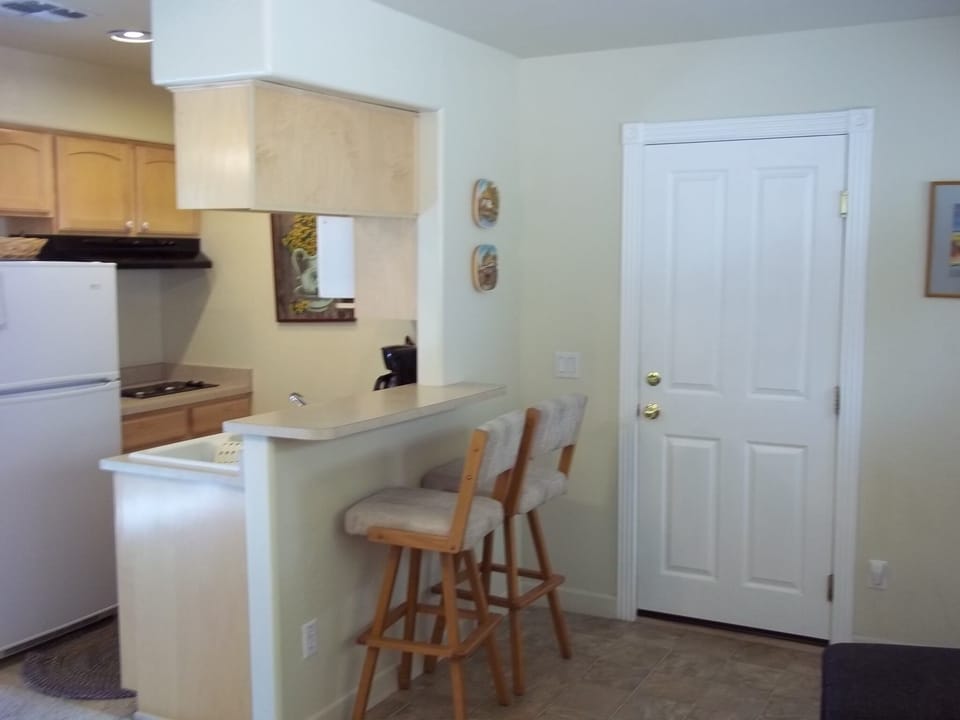 Showing breakfast bar and garage entrance door.