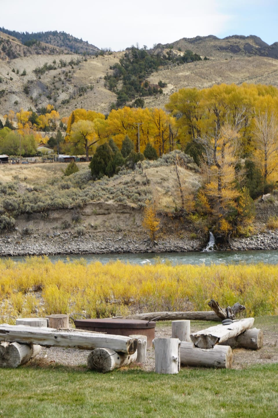 View from cabin of fire pit and river.