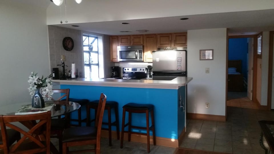 Updated Kitchen with Stainless steel appliances And Extra Bar Stools