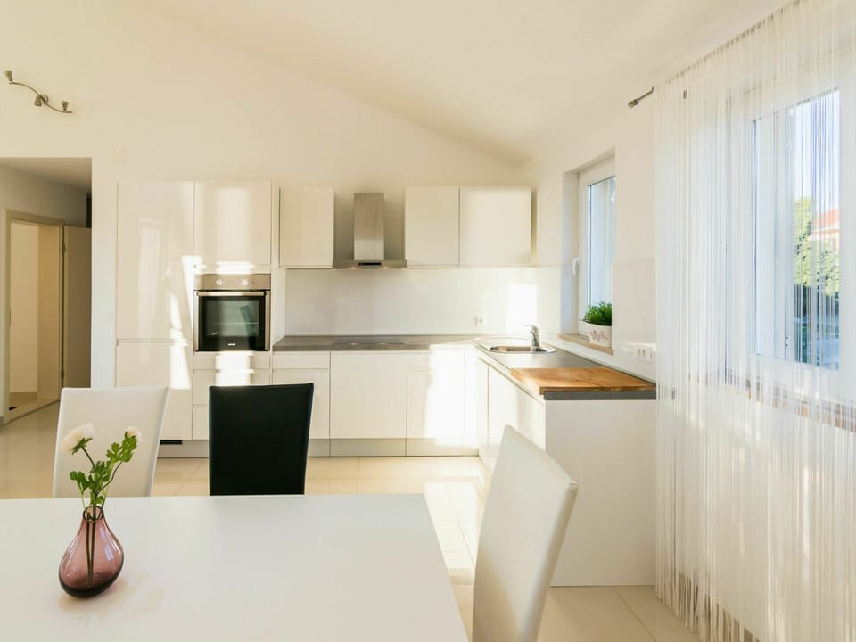 Cabinetry, Countertop, Home Appliance, Kitchen Stove, Kitchen Appliance, Wood, Houseplant, Kitchen, Flooring, Floor
