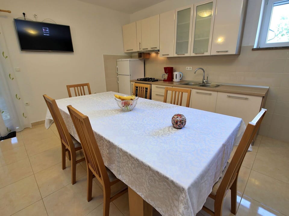 Table, Furniture, Cabinetry, Wood, Chair, Lighting, Kitchen, Interior Design, Countertop, Kitchen & Dining Room Table
