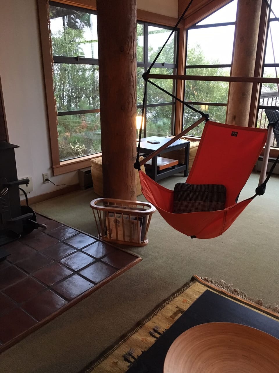 Comfortable hammock chair and a game table in the corner.