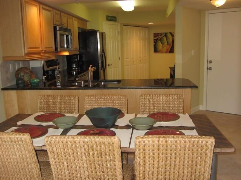 Dining area looking back into the fully furnished kitchen.