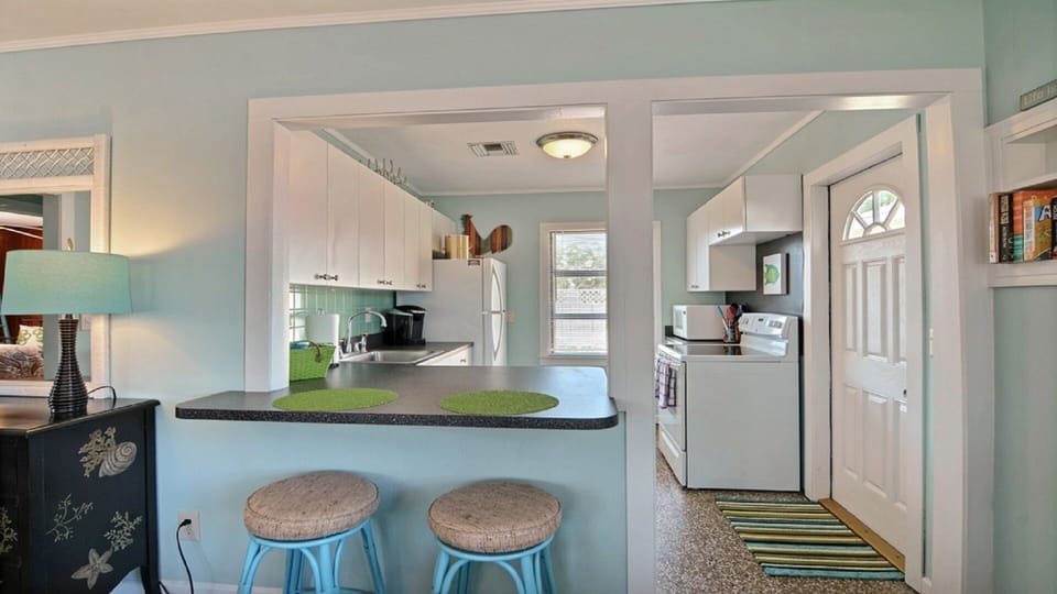Good size fully equiped galley kitchen opens into the dining and living spaces.