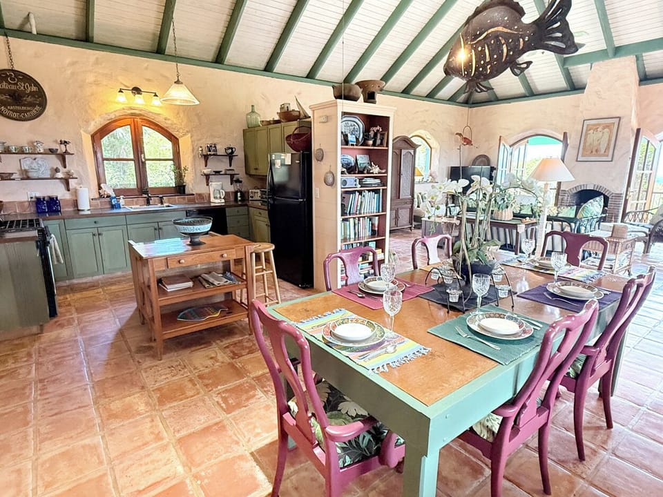 Looking from the dining area to the kitchen and living room