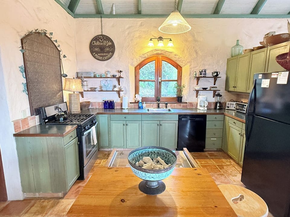 The kitchen is located next to the dining area...