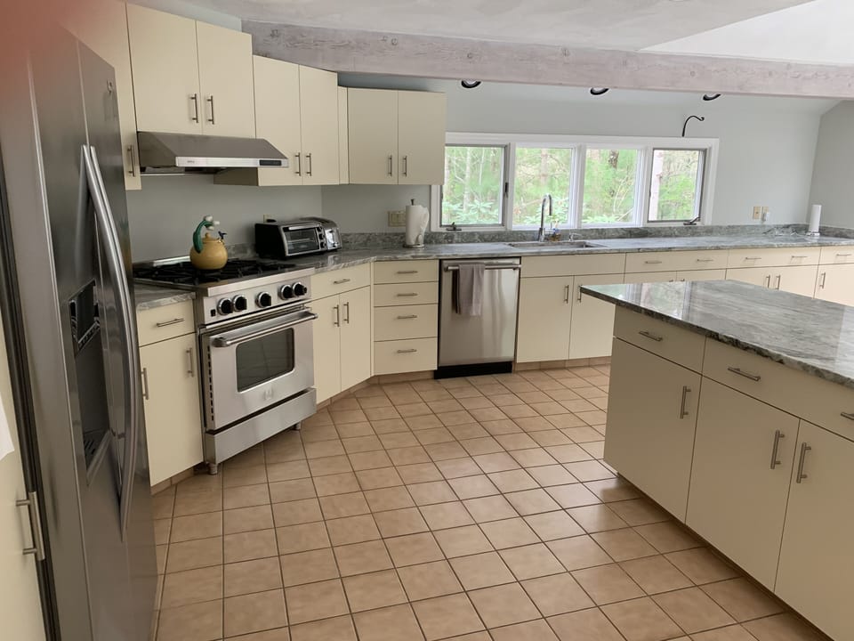 Kitchen with brand new granite counters and stainless appliances.