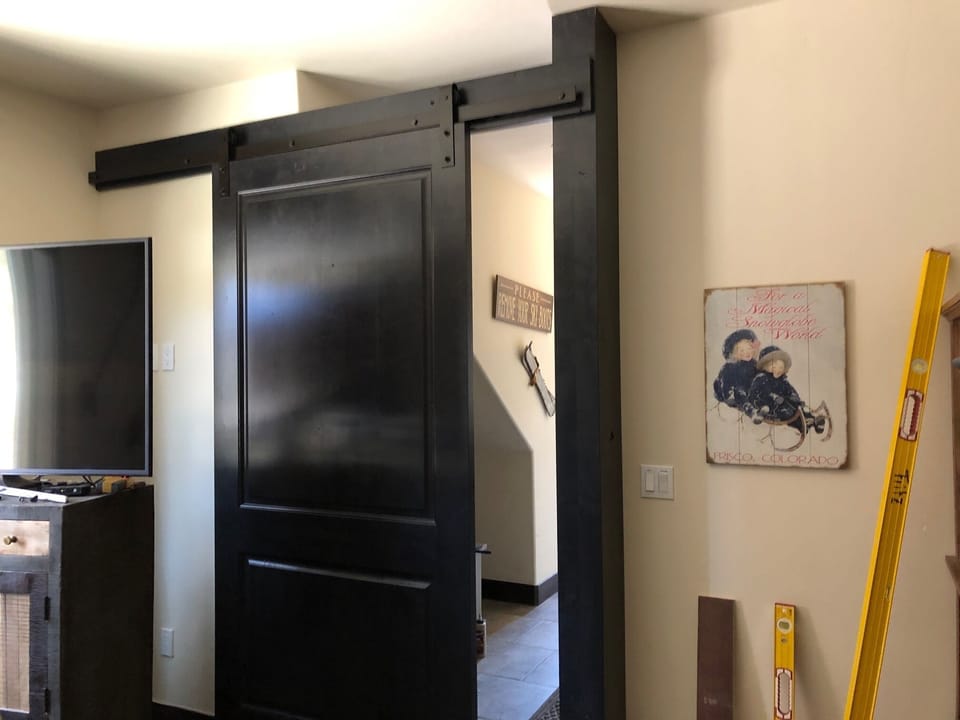 Bunk room has a door that will completely block it from the hall and stairs.