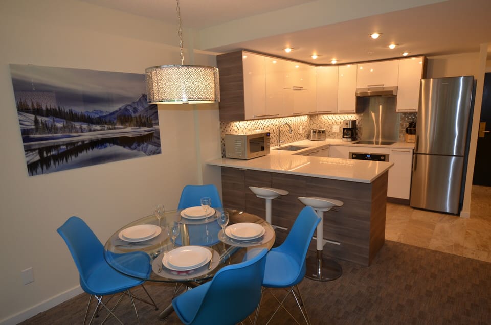 Redesigned kitchen; seating for 4 in the dining area; 2 high chairs.