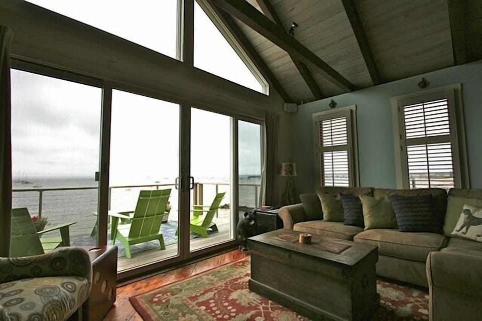 View of living room out to back deck