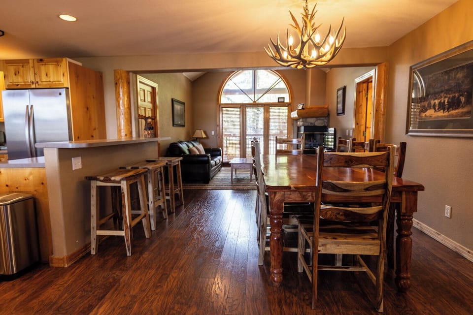 Dining room table seats 8. Second living room in back ground.