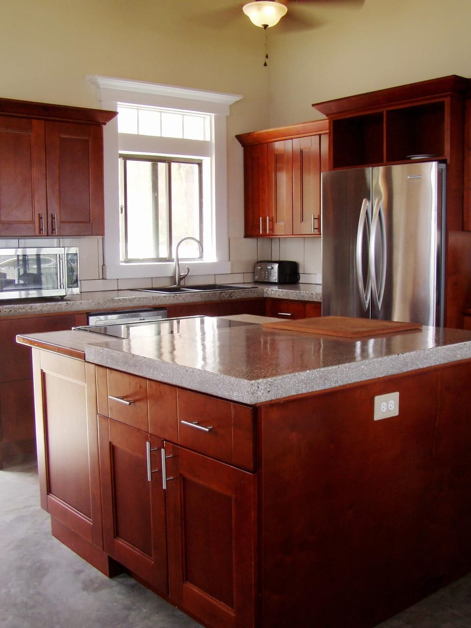 Main House Stainless Kitchen with hi-tech concrete counters.