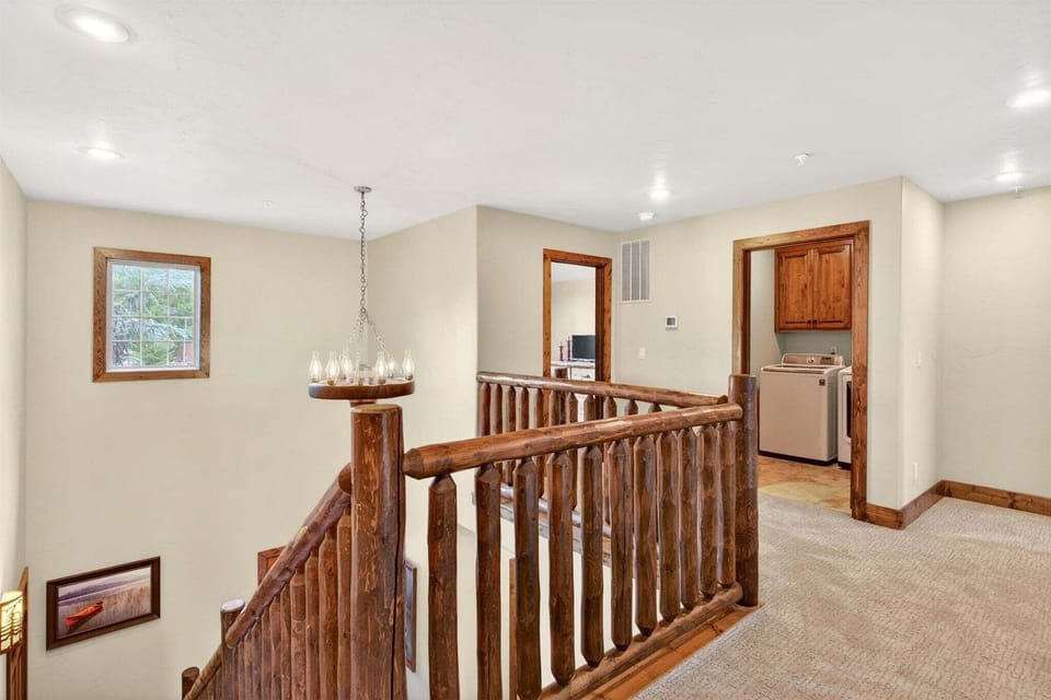 Upstairs area with access to laundry room and two upper level bedrooms