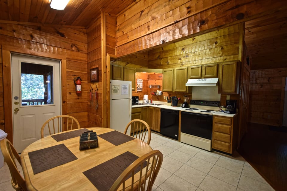 Large kitchen and dining area.  Screened in porch off kitchen with a grill.