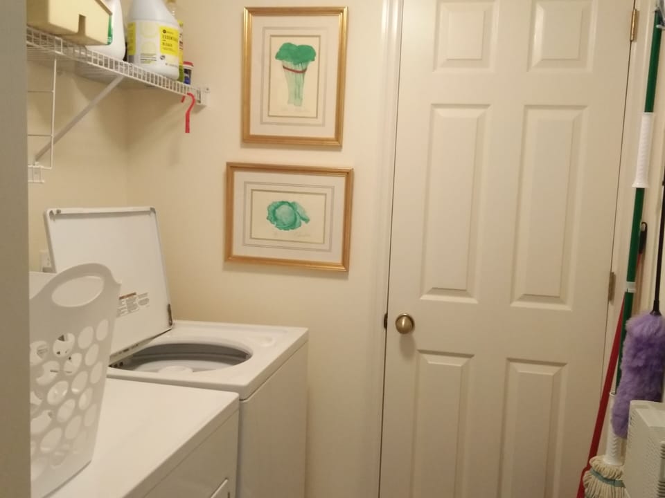Separate Laundry room off foyer. Full size machines.