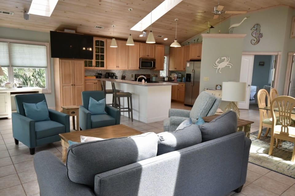 Open and airy living area.  Vaulted ceiling with skylights provides great light.
