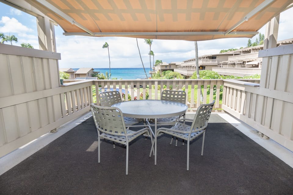 Awning  on living room lanai protects against sun and rain