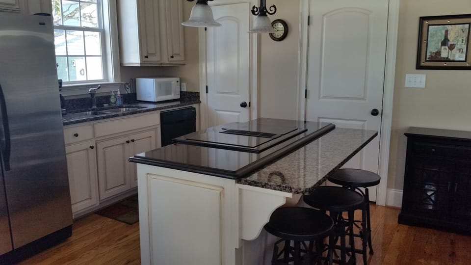 Kitchen with half bath and laundry room