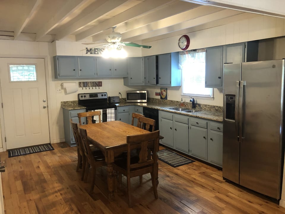 Granite counters, fully stocked kitchen, stainless steel fridge with ice maker.