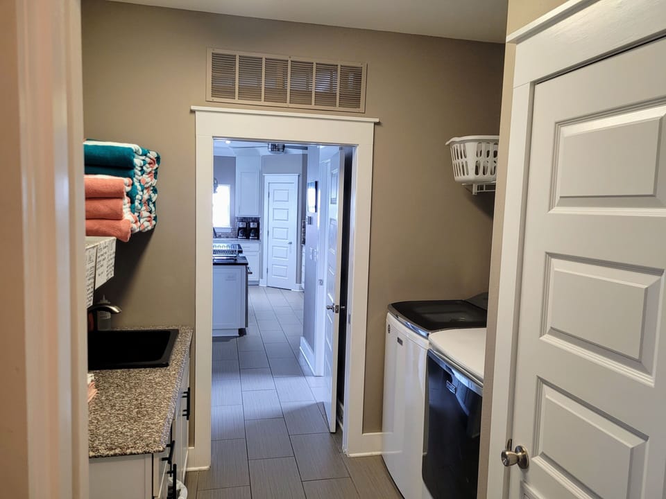 3RD FLOOR LAUNDRY W/OVERSIZED W/D SETS, LARGE SINK & GRANITE FOLDING AREA
