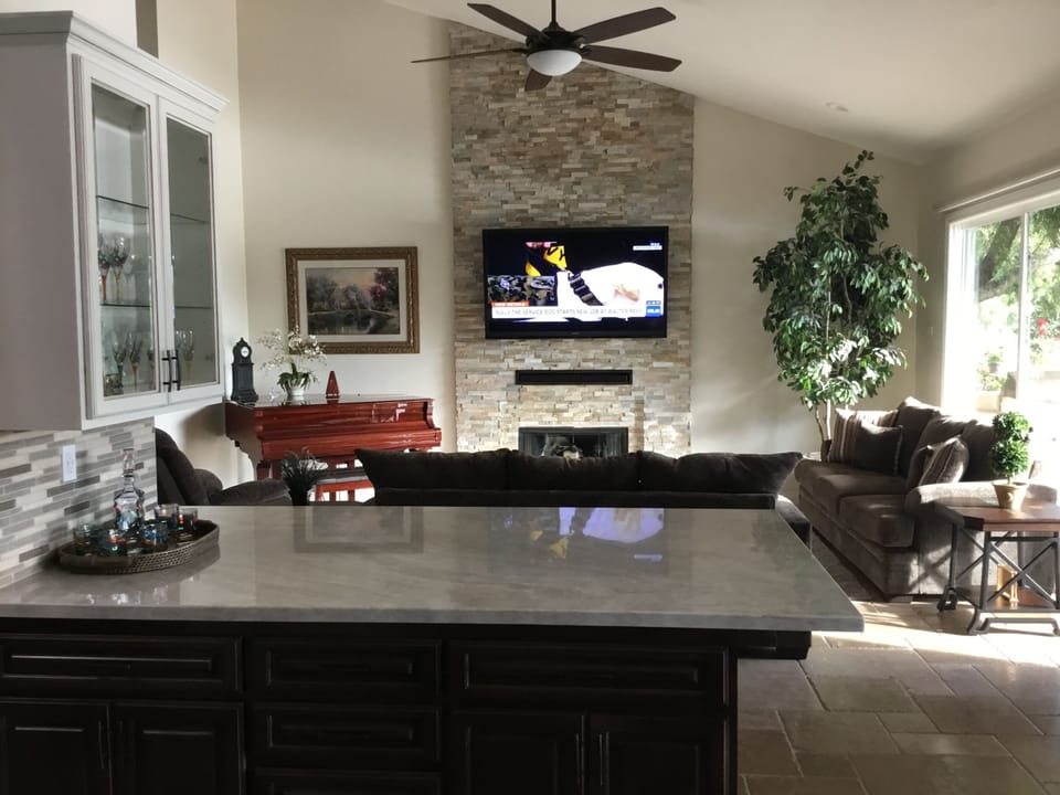 Living room There are windows the length of the patio this house is very light and bright