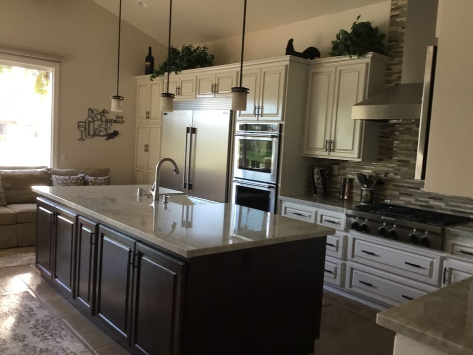 This brand new kitchen has all new KitchenAid appliances with a six burnerg 