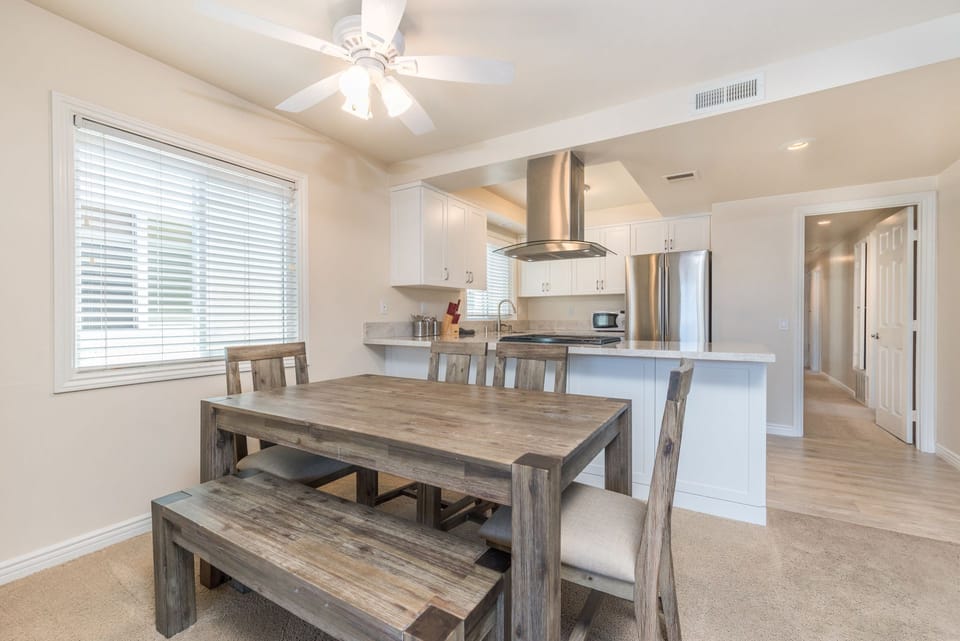 Dining area, adjacent to both kitchen and living areas, is the perfect headquarters for family meals, game night and good conversation.
                