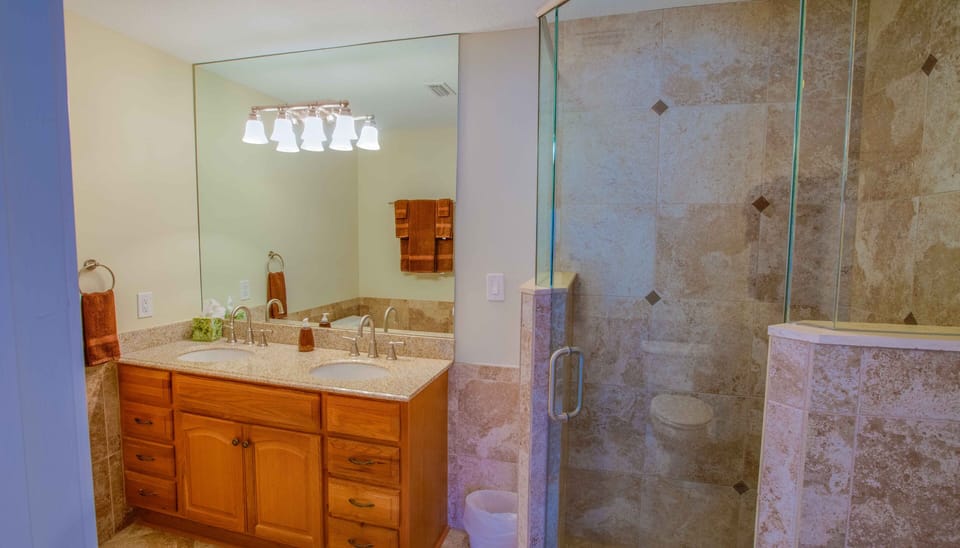 MASTER BATH DOUBLE GRANITE TOPS/WALK IN GLASS/TILE SHOWER WITH CEILING RAIN HEAD THAT FLOWS OVER YOUR BODY