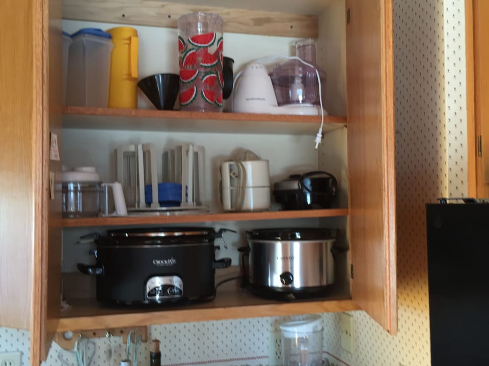 Kitchen is stocked for a crowd-crock pots,  blender, fd processor service for 10