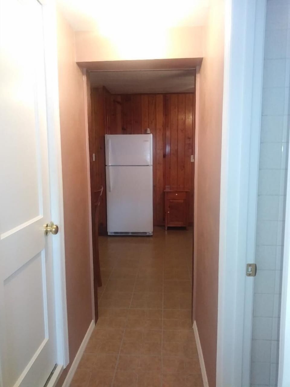 Hallway from laundry room to kitchen and living area