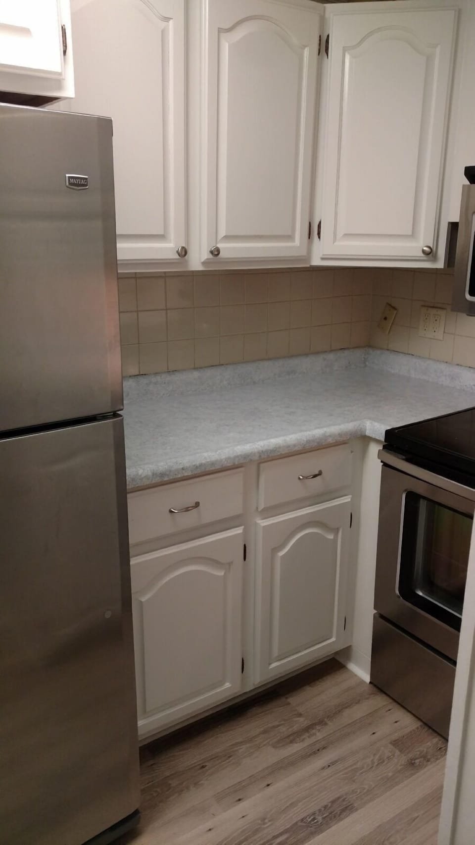 Kitchen-  electric range and microwave hood- all you need to make your own meals