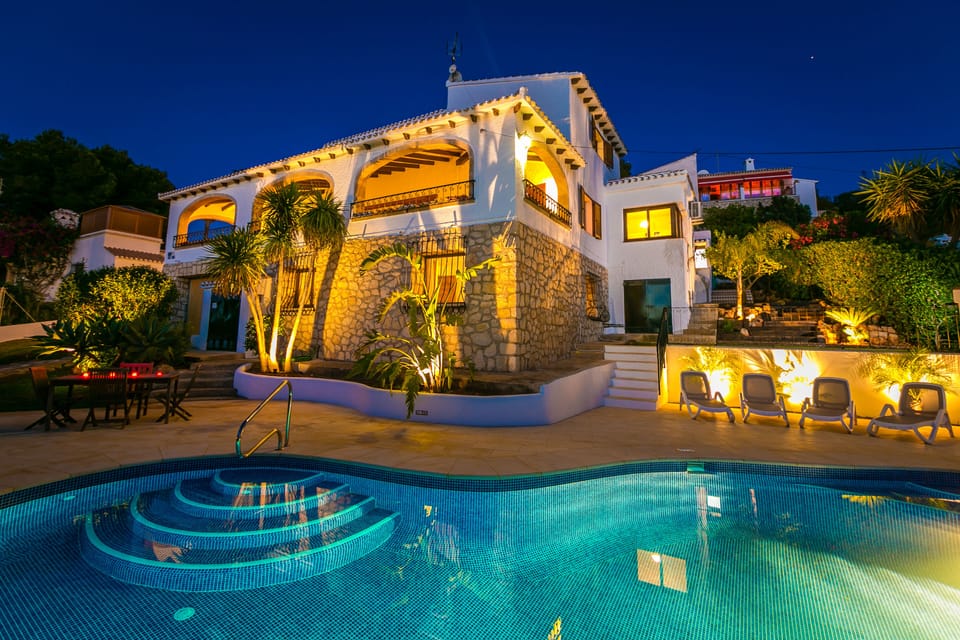 The house from the pool terrace at night
