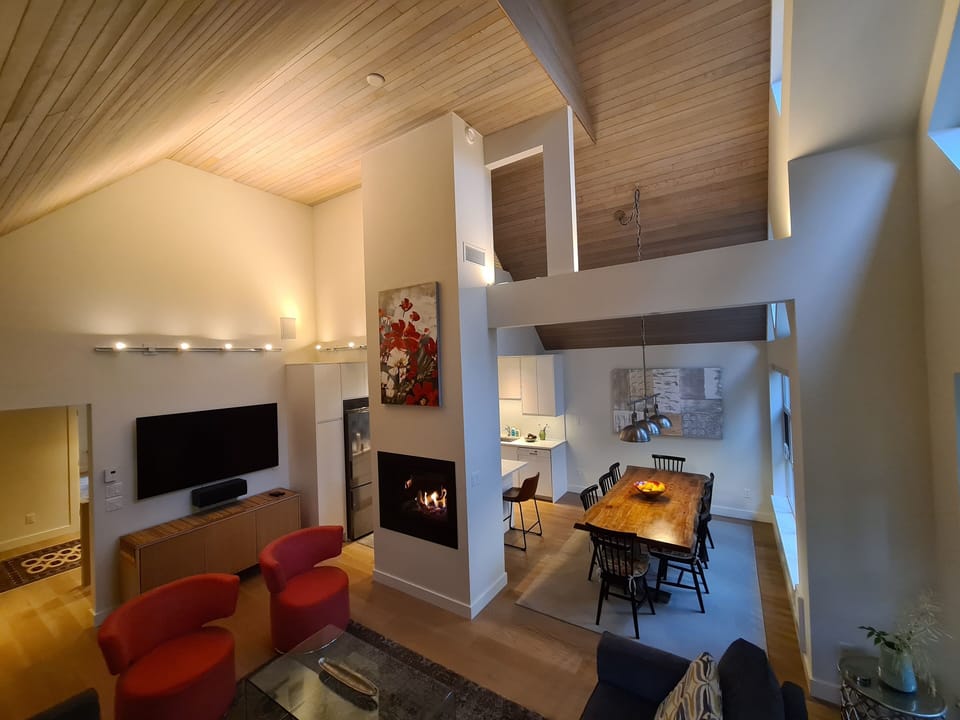 The open plan for living, dining and the kitchen is filled with natural light.