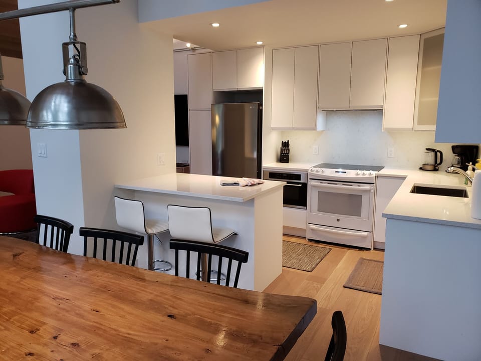kitchen is fully equipped with appliances, dishes and kitchen utensils.