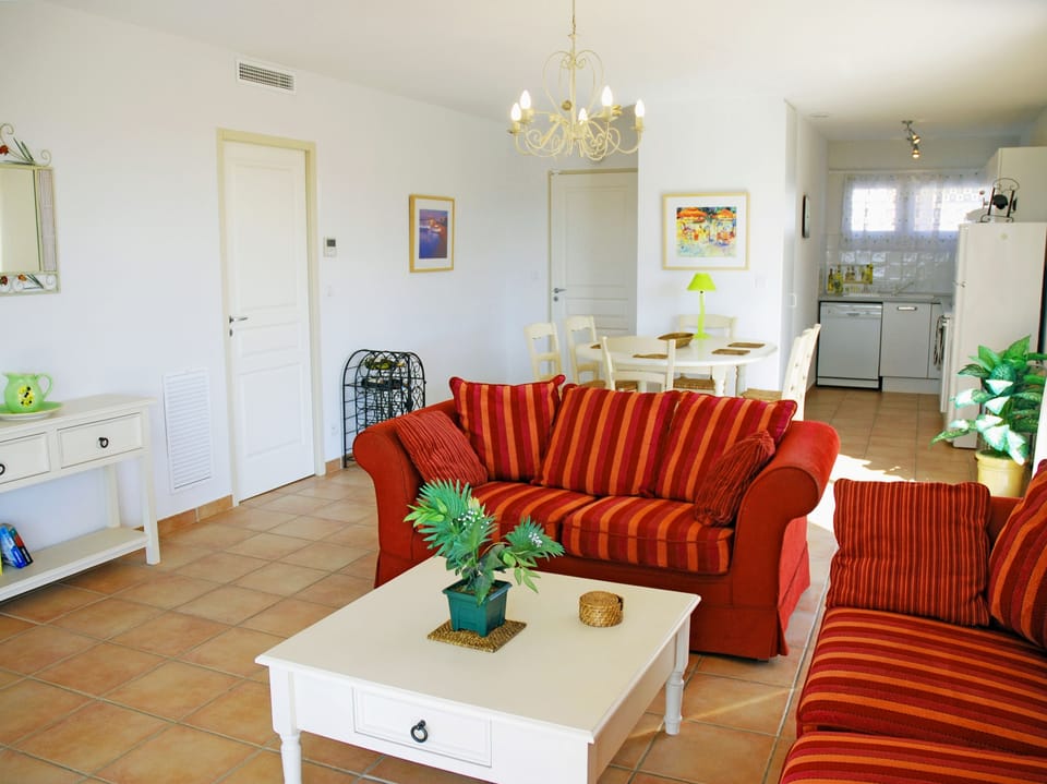 Lounge with dining area and kitchen beyond
(fully air-conditioned)
