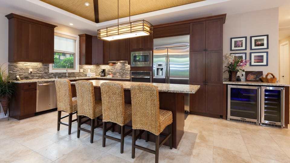 Gourmet Kitchen with large island, and professional wine and beverage fridges, ready for you to load up.