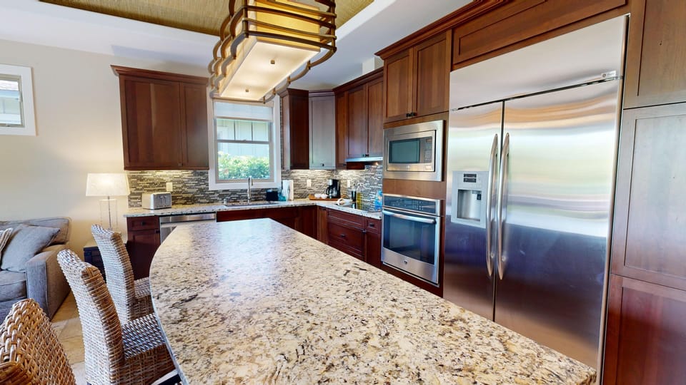 Gourmet kitchen with high end appliances and lots of space for preparing meals