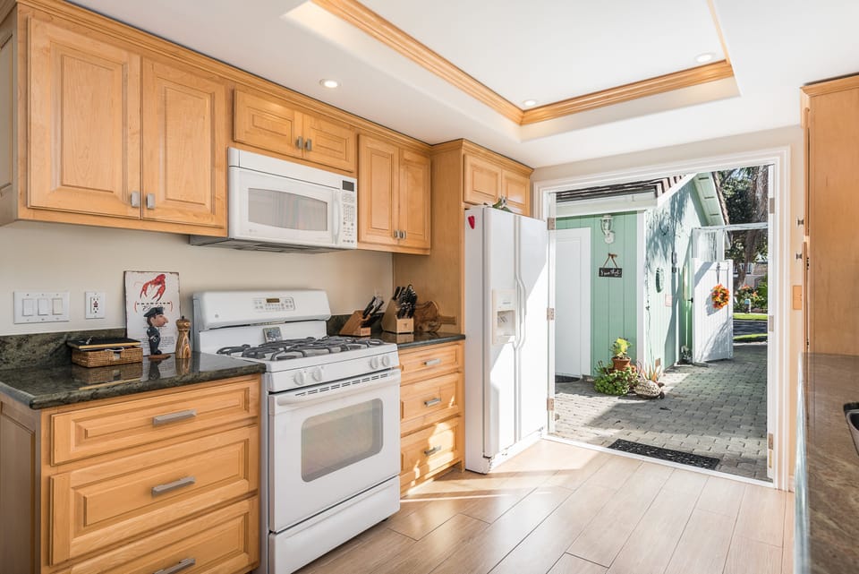Kitchen fully stocked and double doors open to front patio.  
