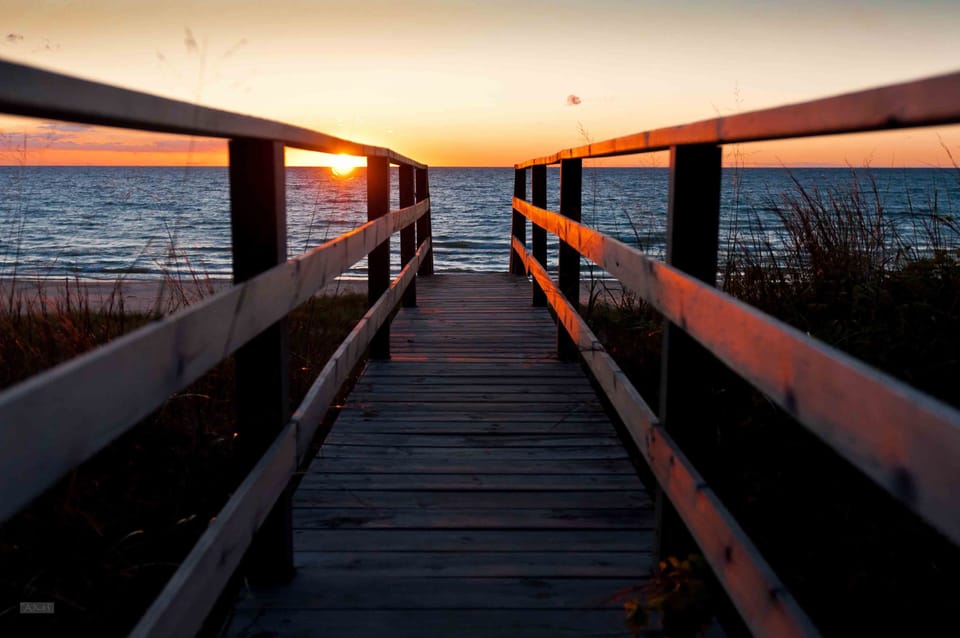 Sunset from the boardwalk toward the beach and lake.