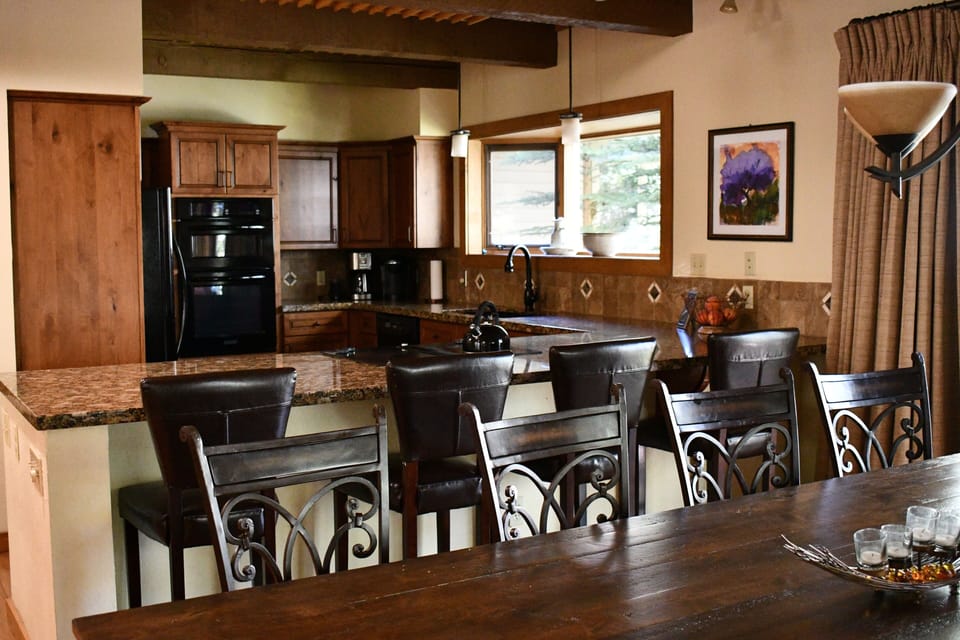 Spacious kitchen, breakfast bar and dining table that seats 10